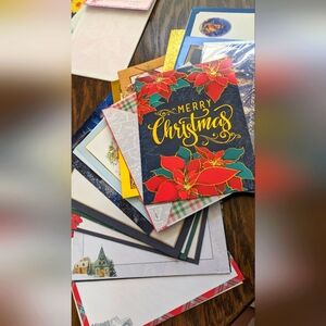 Lot of Christmas cards, notepads, mini recipe books and random small cards.